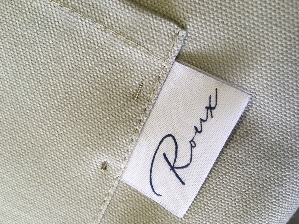 Made to order bespoke tabs and labels on apron pockets